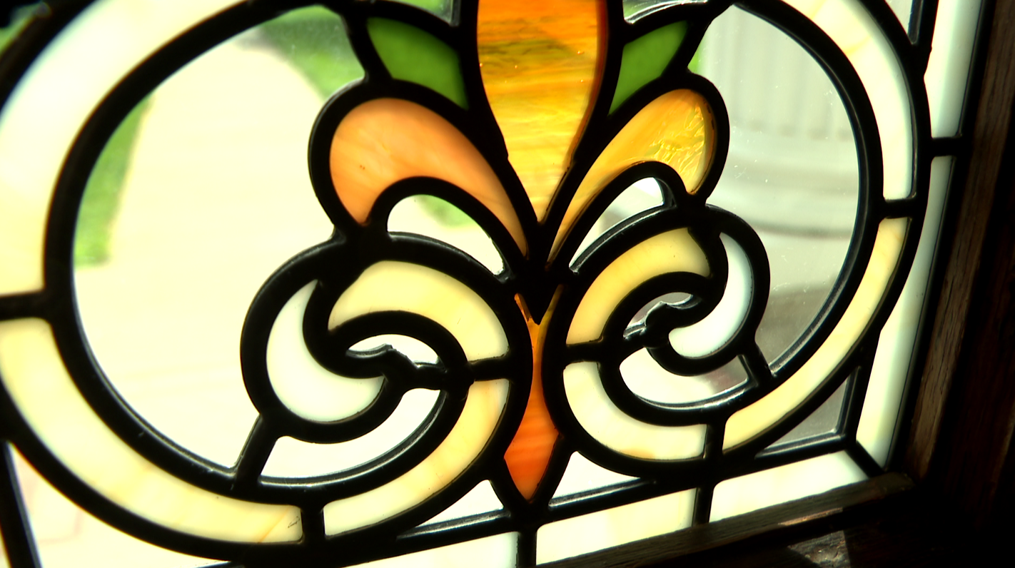 Close up: The bottom of one of the front door panels created at Rainbow Artistic Glass & Design for the Louis E. May Museum in Fremont.