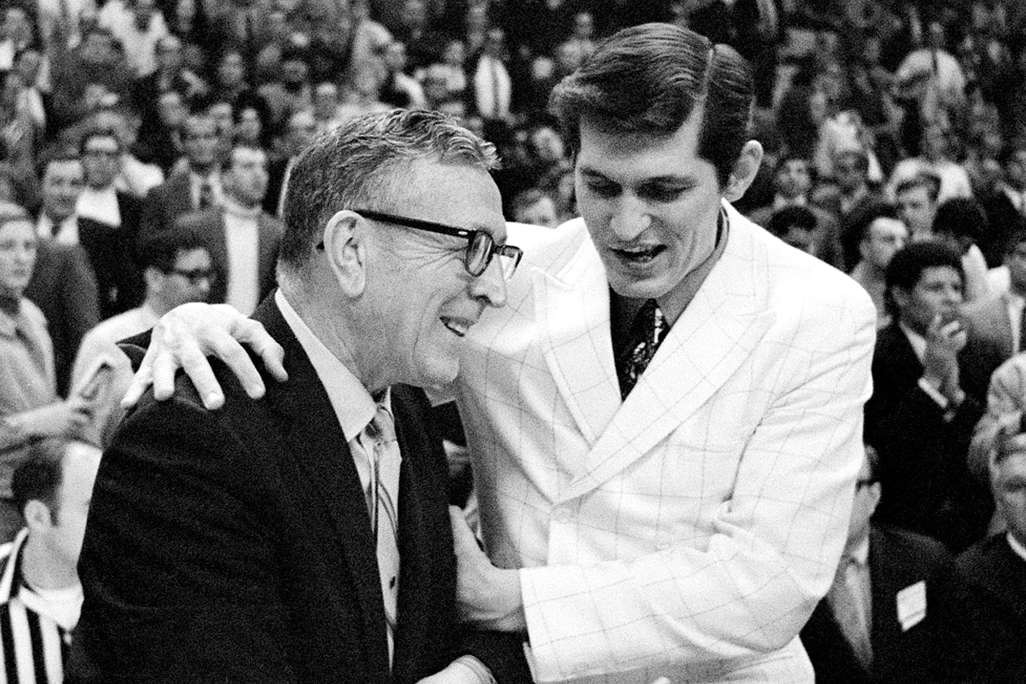 Jacksonville Dolphins head coach Joe Williams speaks to UCLA Bruins head coach John Wooden in 1970 NCAA national championship game