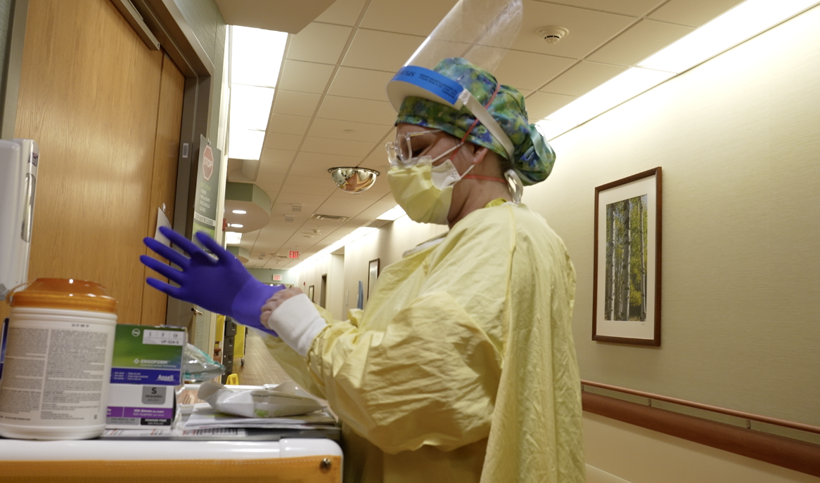 Nurse Krystyn Grabiel getting ready to treat a COVID patient at the Sparrow Main Hospital COVID unit