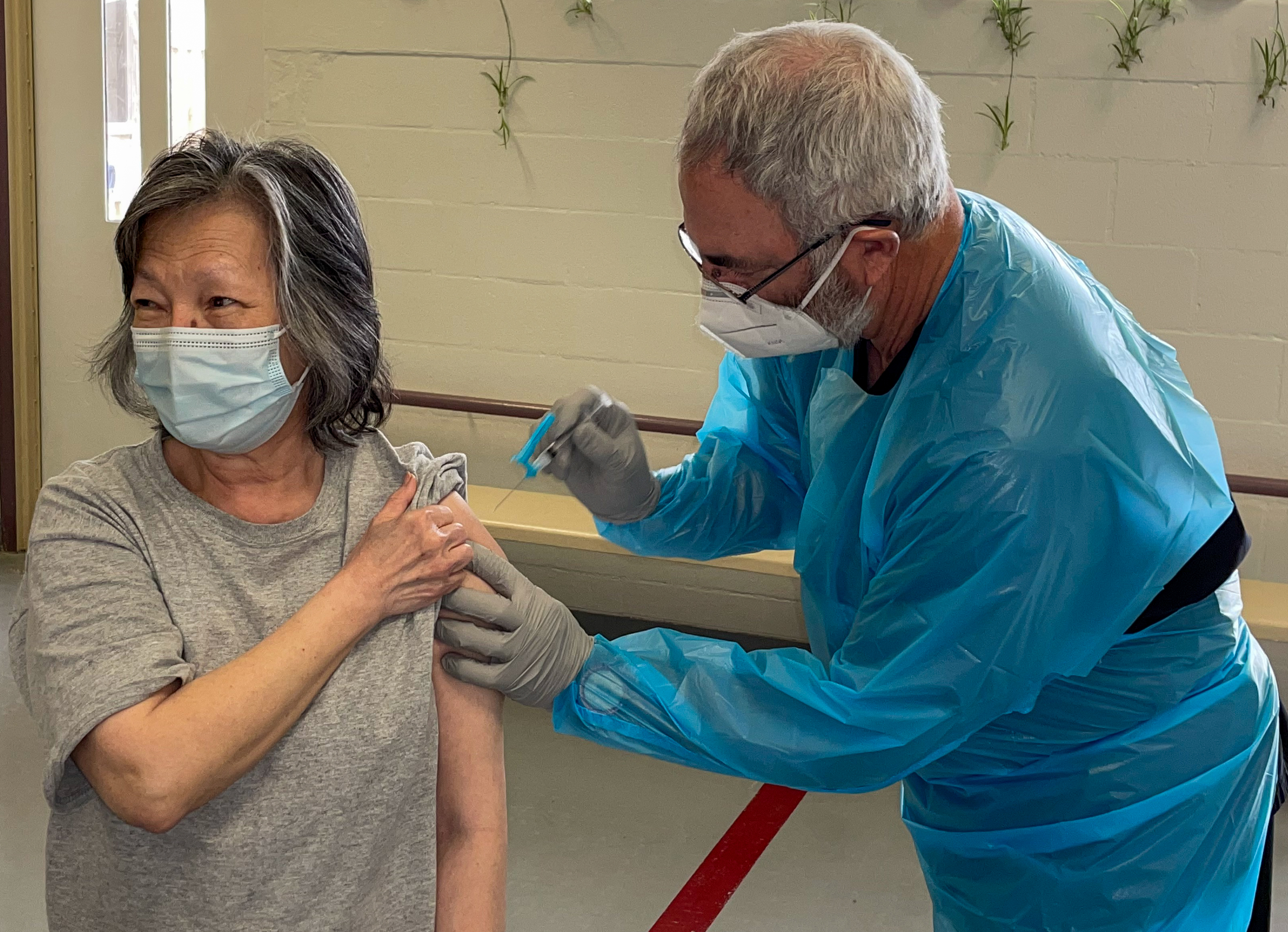 A Utah State Prison inmate receives her COVID-19 vaccination.