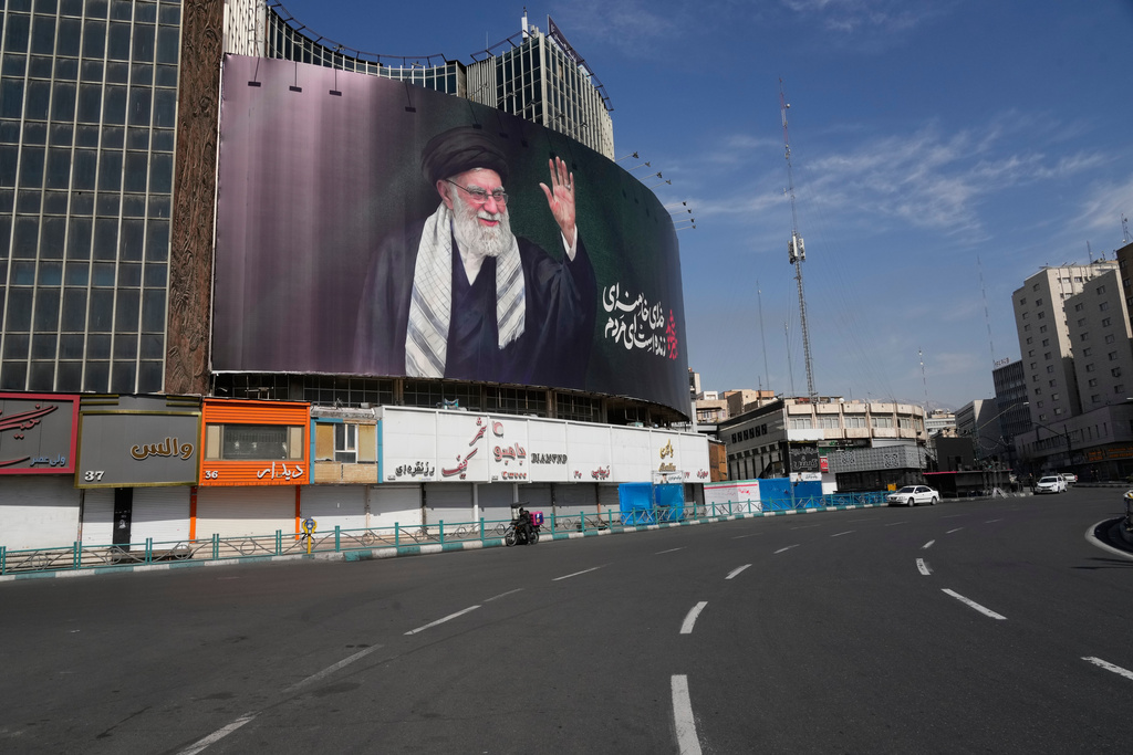 A billboard showing a portrait of the late Iranian Supreme Leader Ayatollah Ali Khamenei, who was killed in U.S.-Israeli strikes, looms over an empty square in Tehran, Iran, Thursday, March 5, 2026. 
