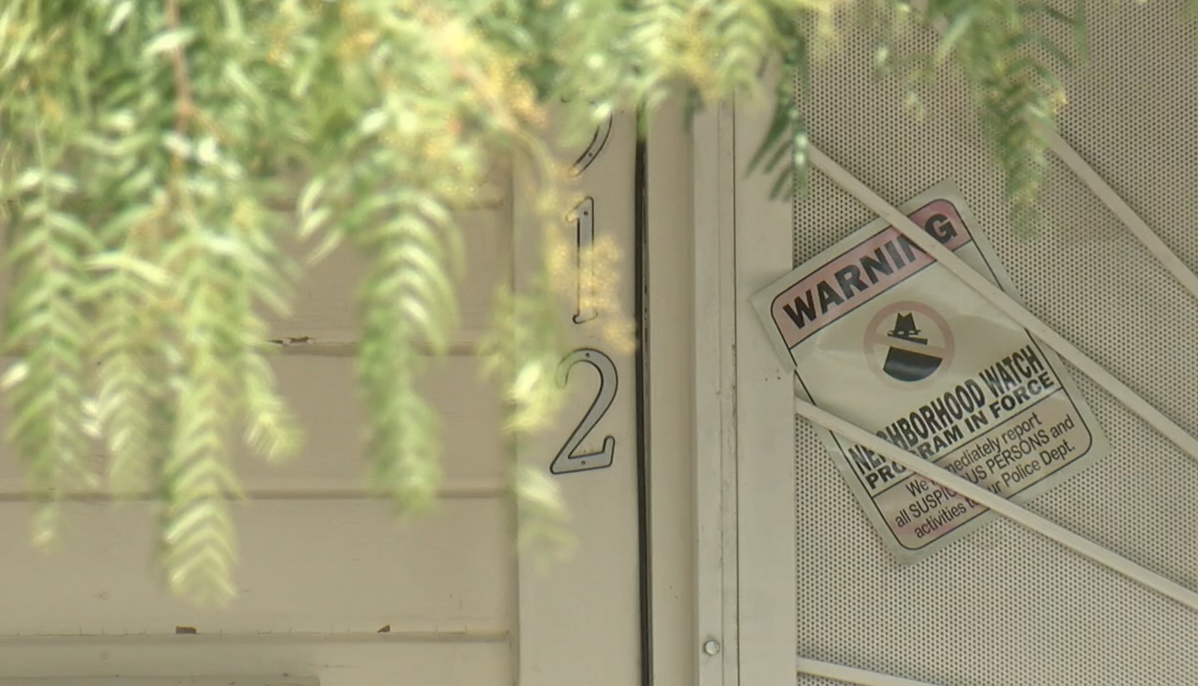 neighborhood watch sign on house door