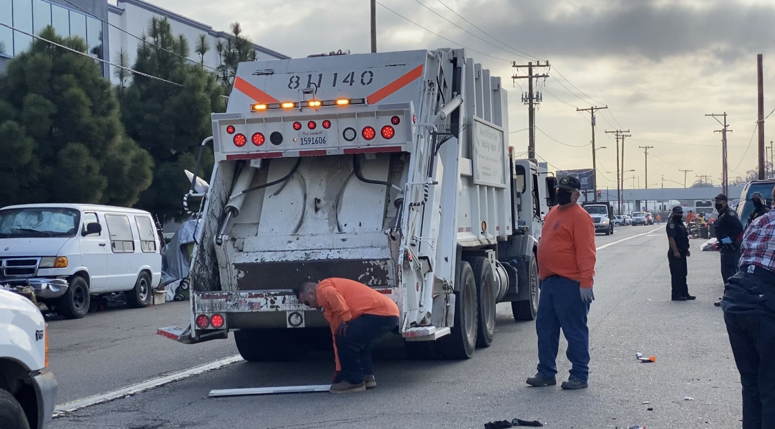 City crews clean up encampment.jpg