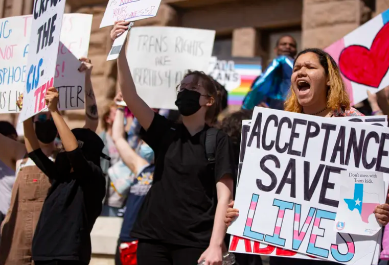 Naia Fulton-Jones chants in front of the Texas Capitol to protest for transgender kids' rights on Tuesday, Mar. 1, 2022. 
