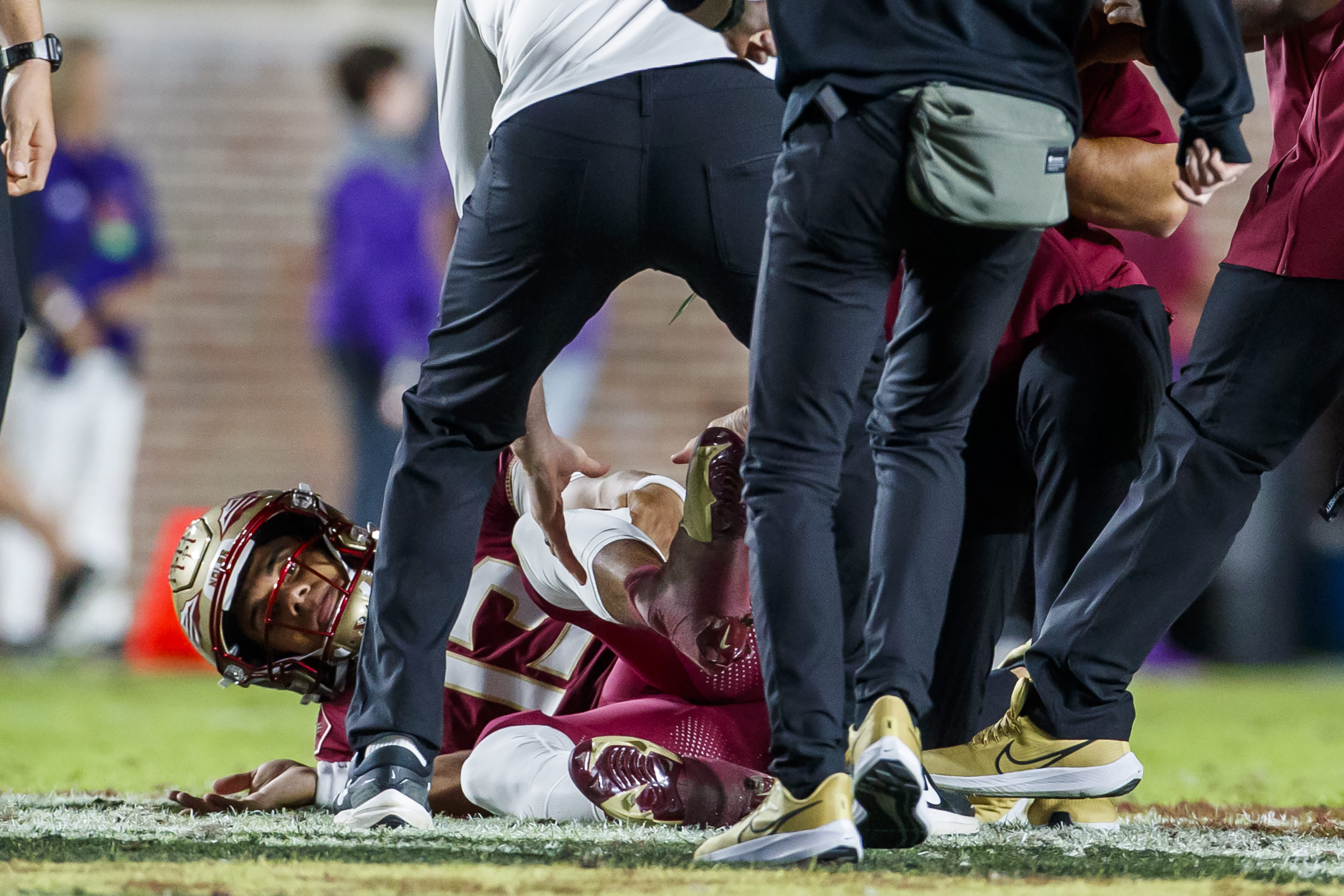 Florida State Seminoles QB Jordan Travis tended to on field after injury vs. North Alabama Lions, Nov. 18, 2023