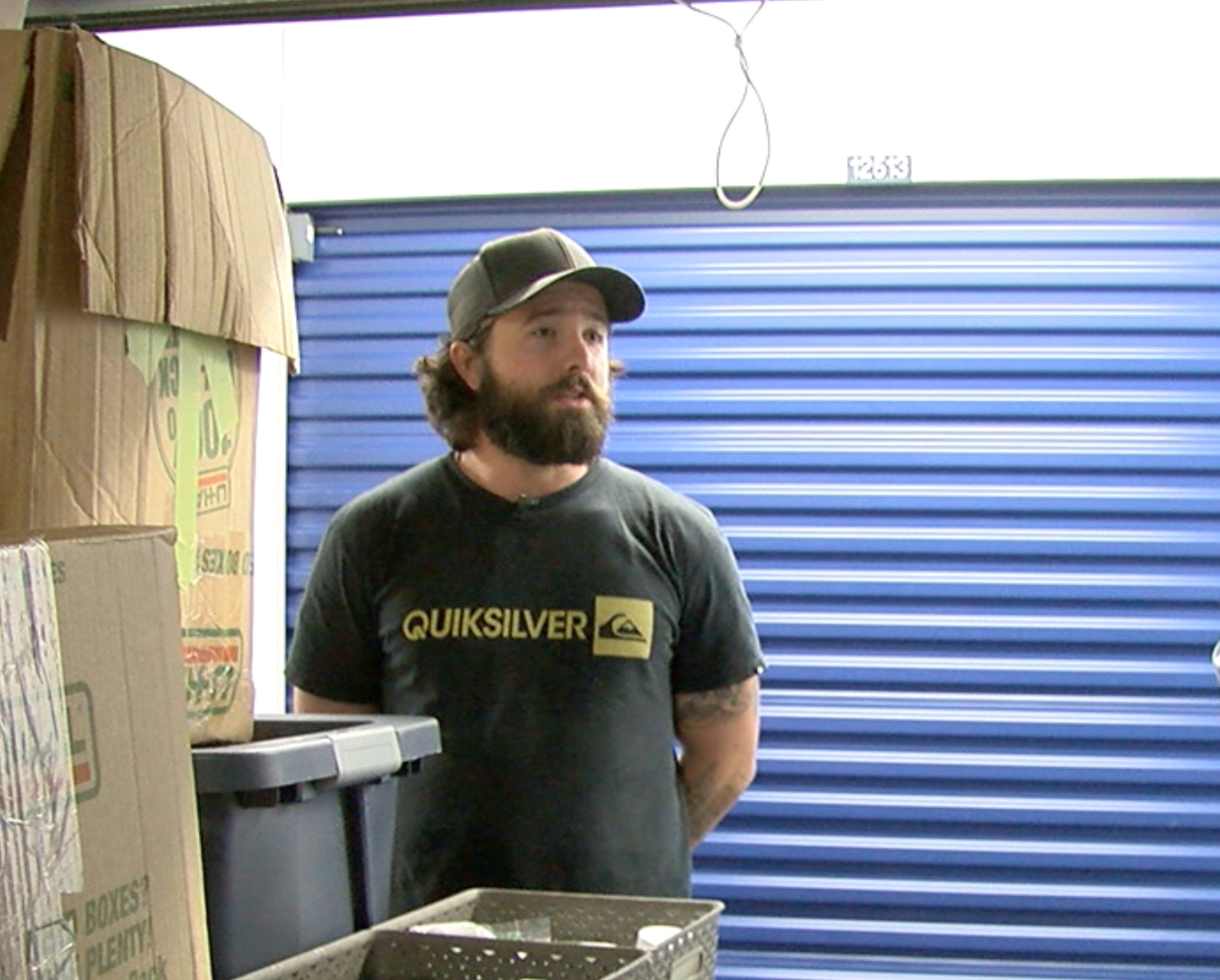 Ryan David Standing in front of his belongings