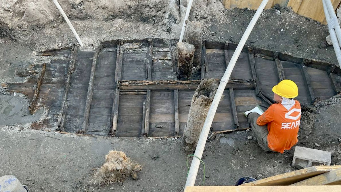 Archaeologists with the Southeastern Archaeological Research Inc. excavate a boat estimated to be about 150 years old buried in St. Augustine.