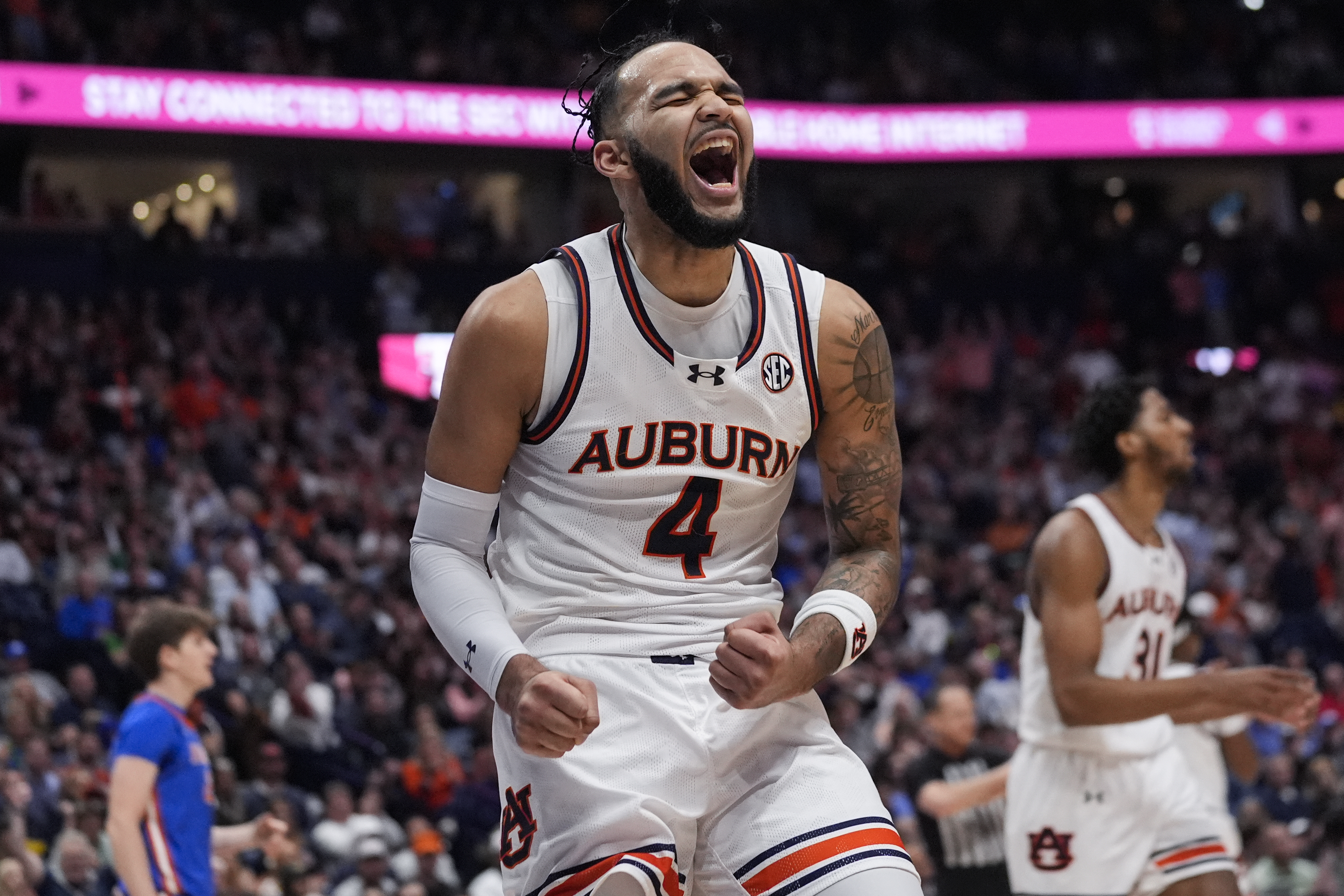Auburn Tigers forward Johni Broome reacts in first half of SEC Tournament final vs. Florida Gators, March 17, 2024