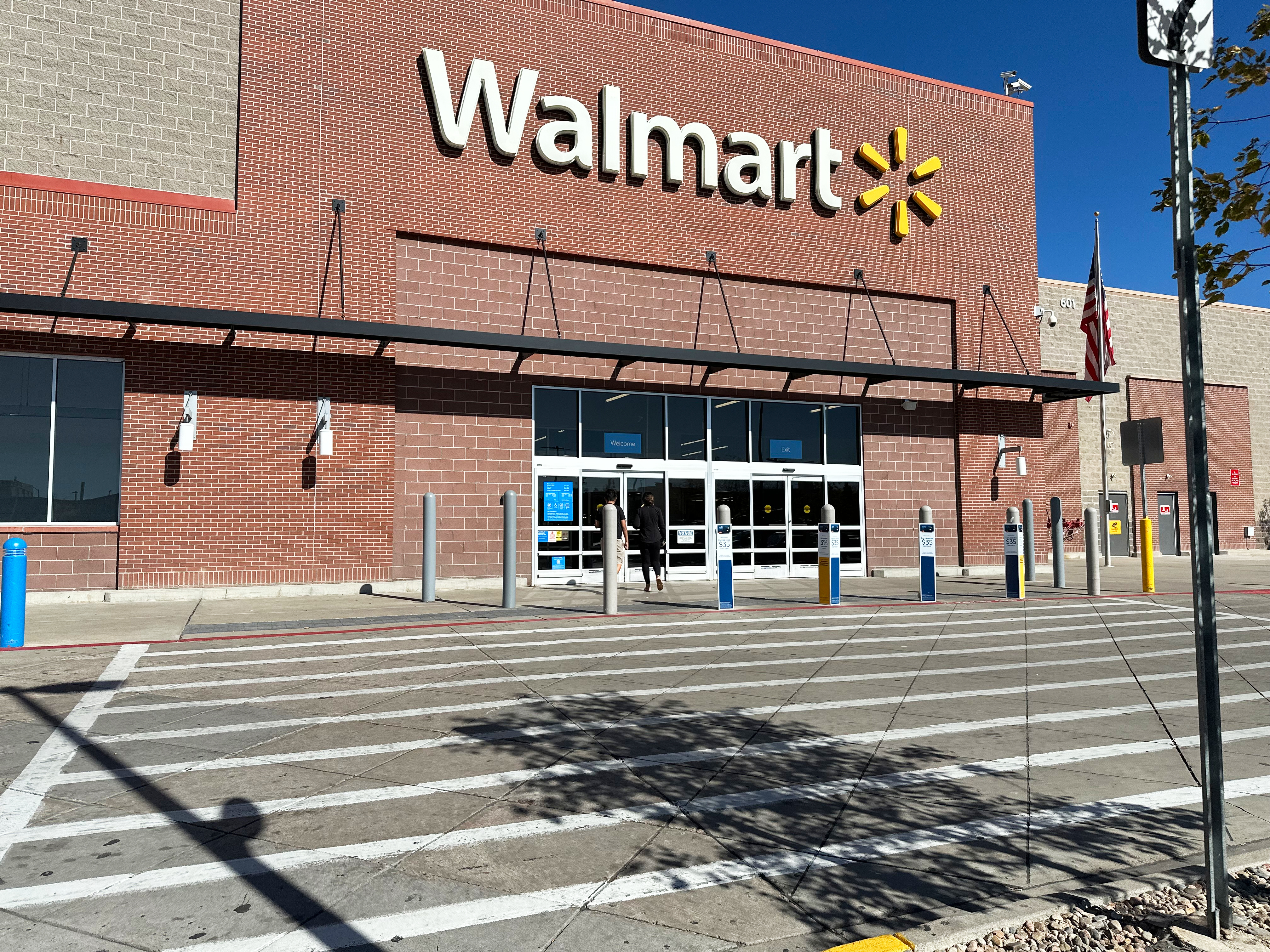 A shopper heads into a Walmart store Thursday, Oct. 16, 2025, in Englewood, Colo. 