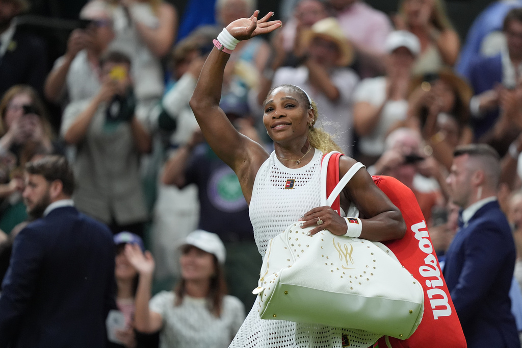Serena Williams of the United States greets the audience as she leaves after losing to Maya Joint of Australia in their first round women's singles match at the Wimbledon Tennis Championships in London, Tuesday, June 30, 2026.