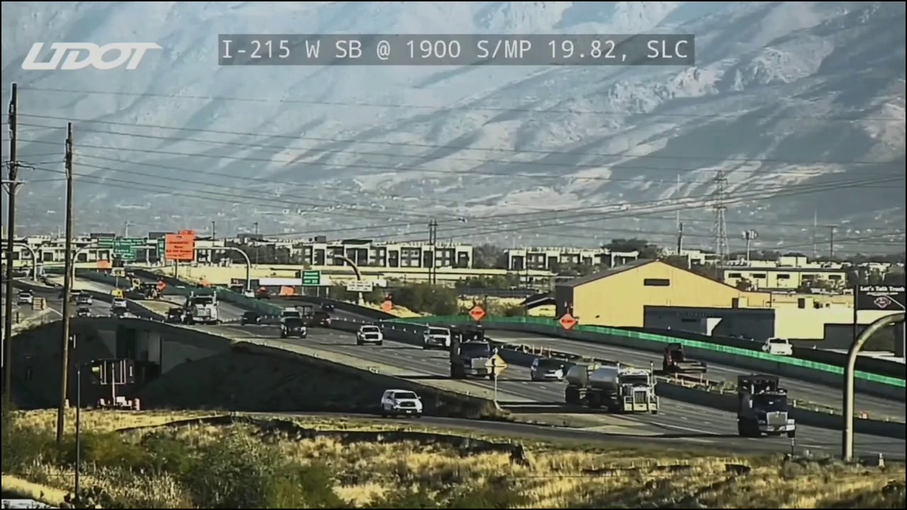 A still from a UDOT traffic camera showing the area near where the fuel spill was reported. It is daytime, and traffic is flowing normal, but some emergency vehicles can be seen in the distance.