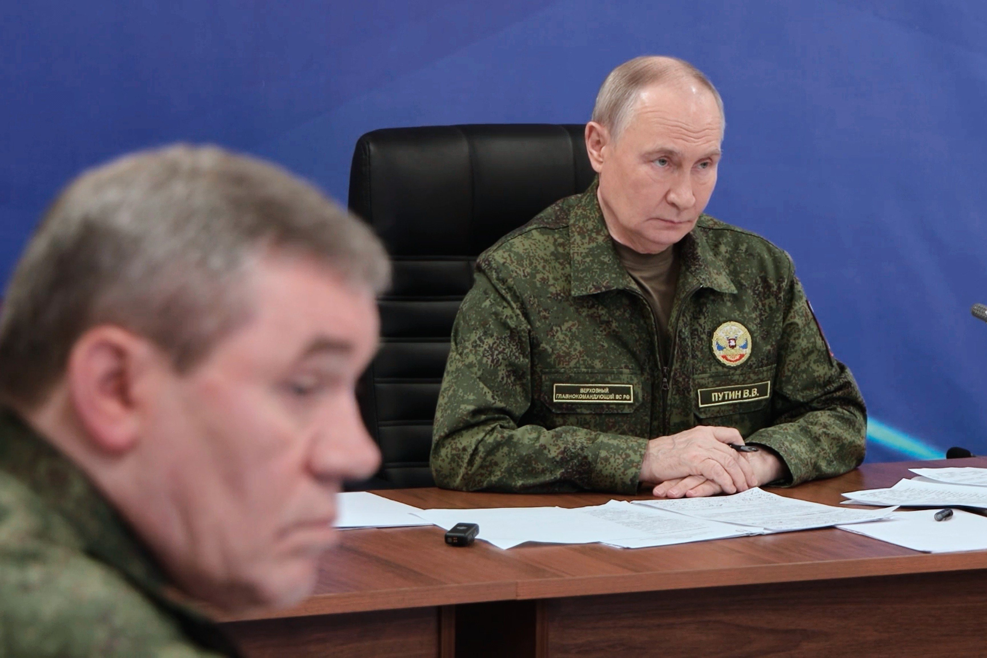 In this image taken from video provided by Russian Presidential Press Service on Sunday, Dec. 28, 2025, Russian President Vladimir Putin speaks as he visits one of the command posts of the Joint Group of the Russian Forces as Russian Chief of General Staff Gen. Valery Gerasimov, left, sits near, at an undisclosed location.