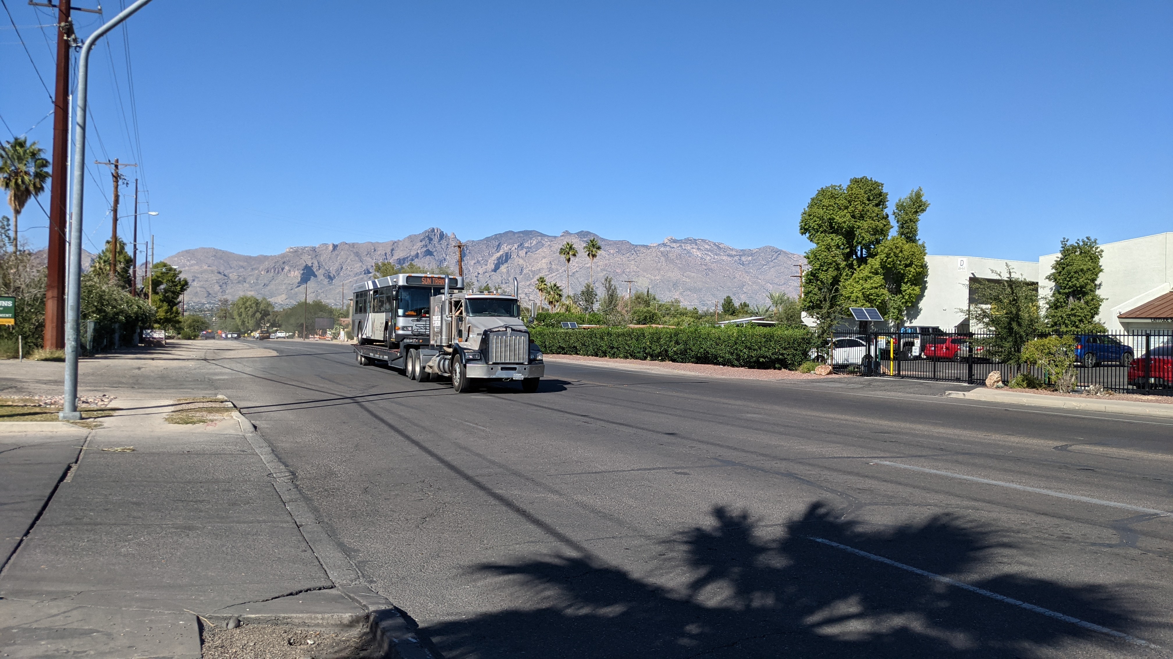Sun Tran bus hauled away after getting wheel stuck in sinkhole