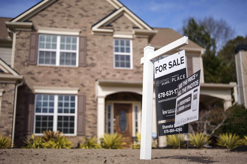 A for sale is displayed outside a home.