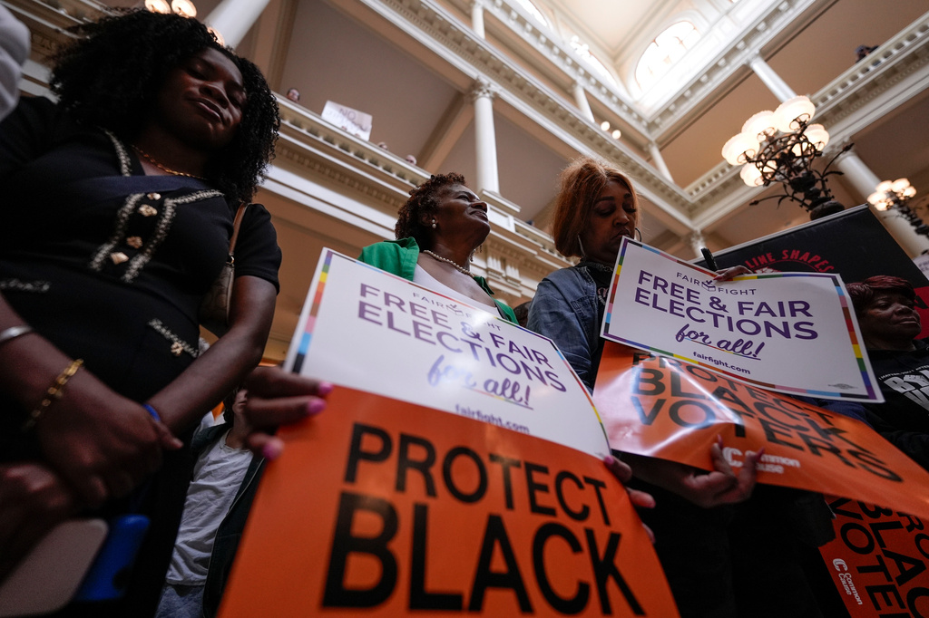 People demonstrate during a special legislative session at the state capitol, Wednesday, June 17, 2026, in Atlanta.