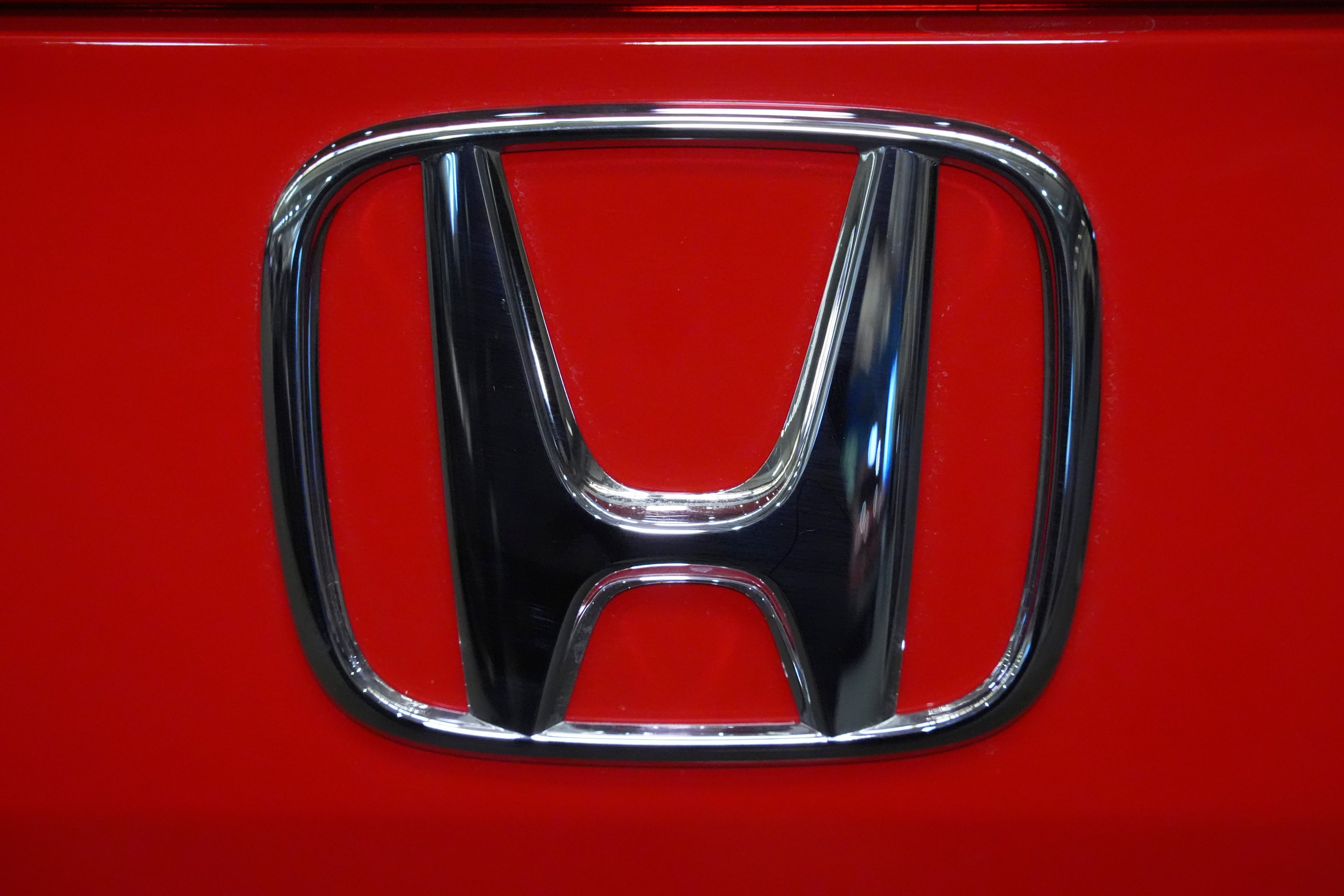 FILE - This is the Honda logo on a Honda Civic Sport Touring automobile on display at the Pittsburgh International Auto Show in Pittsburgh, Feb. 14, 2025. 