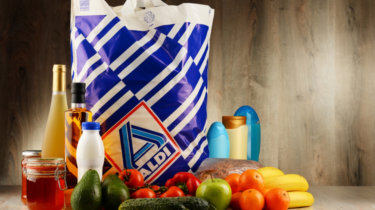 Aldi plastic bag with assorted grocery items in front of it