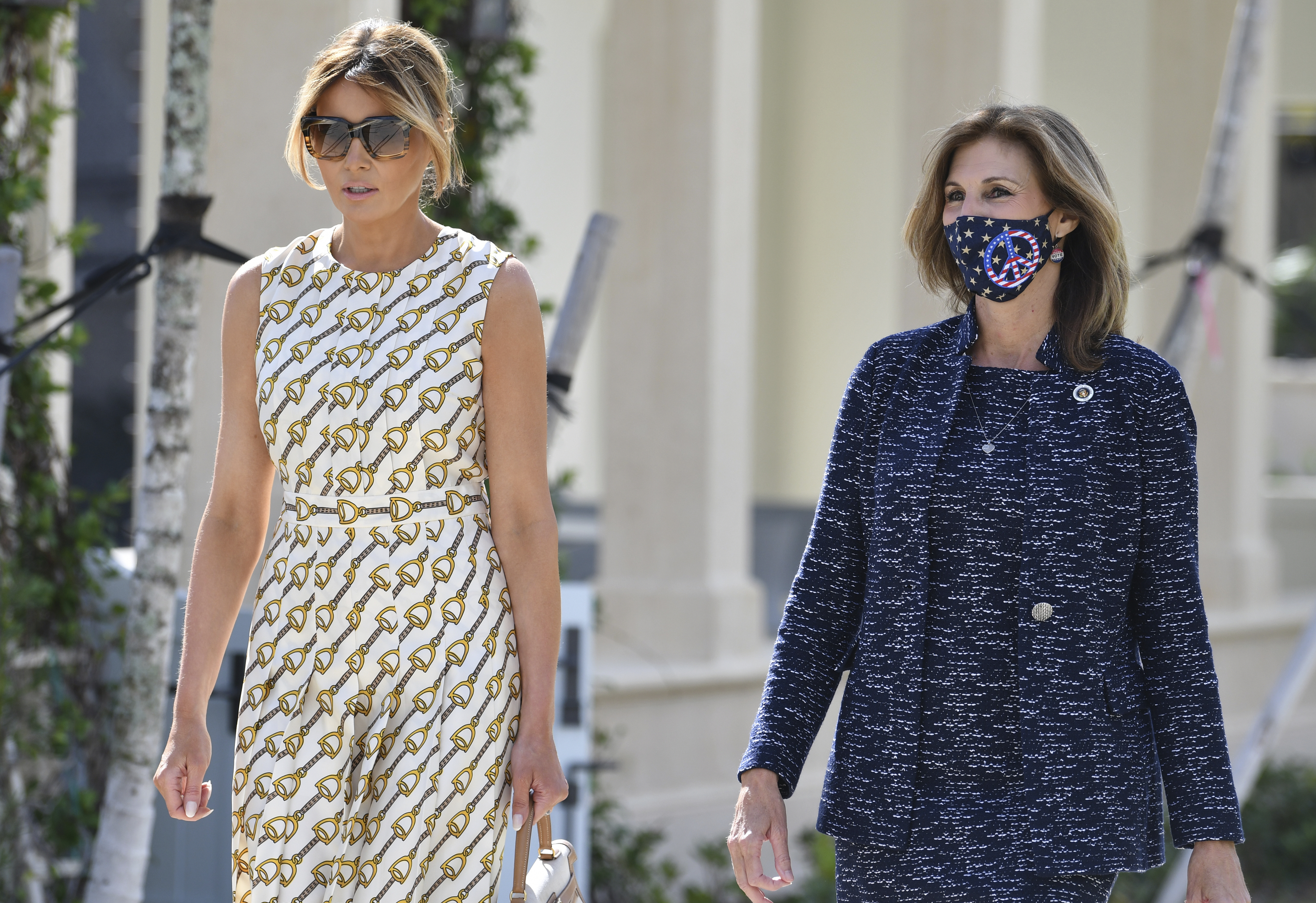 Melania Trump walks with Wendy Sartory Link after voting in Palm Beach, Nov. 3, 2020