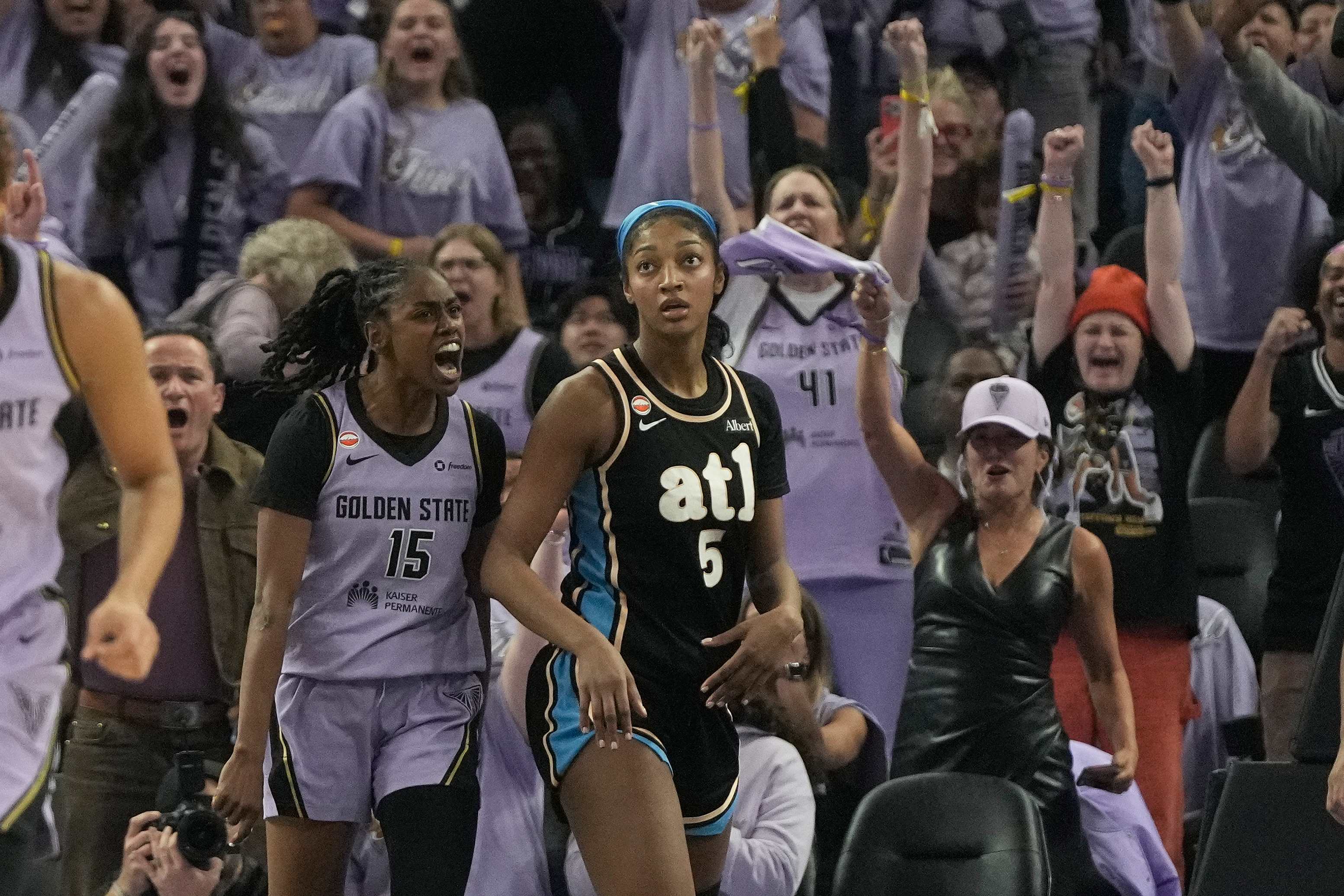 Golden State Valkyries guard Tiffany Hayes (15) celebrates after scoring next to Atlanta Dream forward Angel Reese (5) during the second half of Game 5 of the WNBA basketball finals, Monday, Oct. 26, 2026, in San Francisco. 