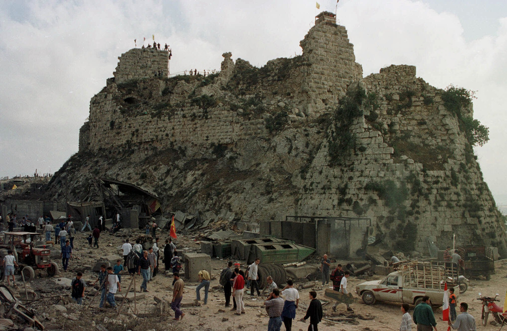 Villagers inspect the damage to Beaufort Castle, 10 kilometers (6 miles) northwest of the southern market town of Nabatiyeh, Lebanon, Wednesday, May 24, 2000. 