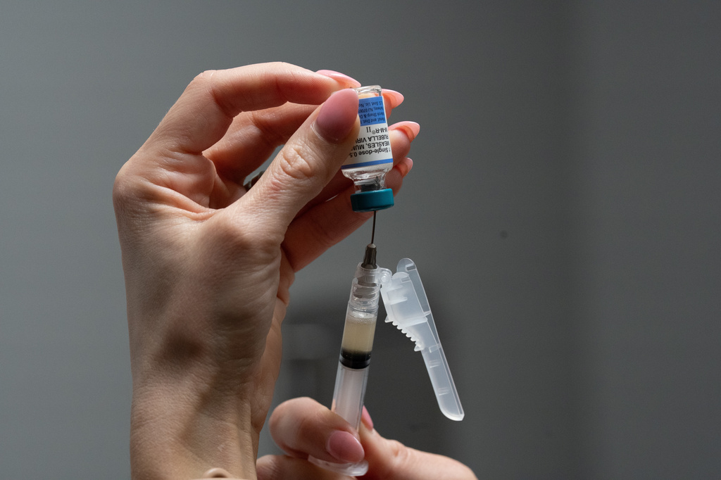Lauren Ellenburg, a nurse, prepares a combination measles, mumps and rubella vaccine for a patient at Tiger Pediatrics in Easley, S.C., March 17, 2026. 