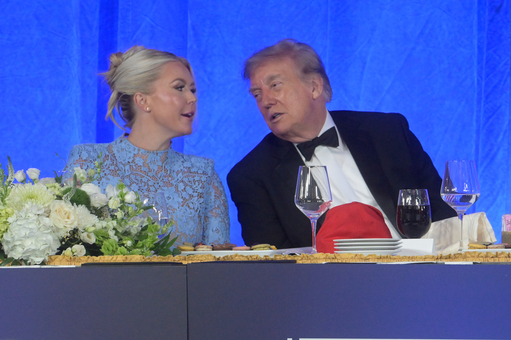President Donald Trump talks with White House press secretary Karoline Leavitt at the White House Correspondents' Association dinner at the Waldorf Astoria Washington DC, Friday, July 24, 2026, in Washington. 
