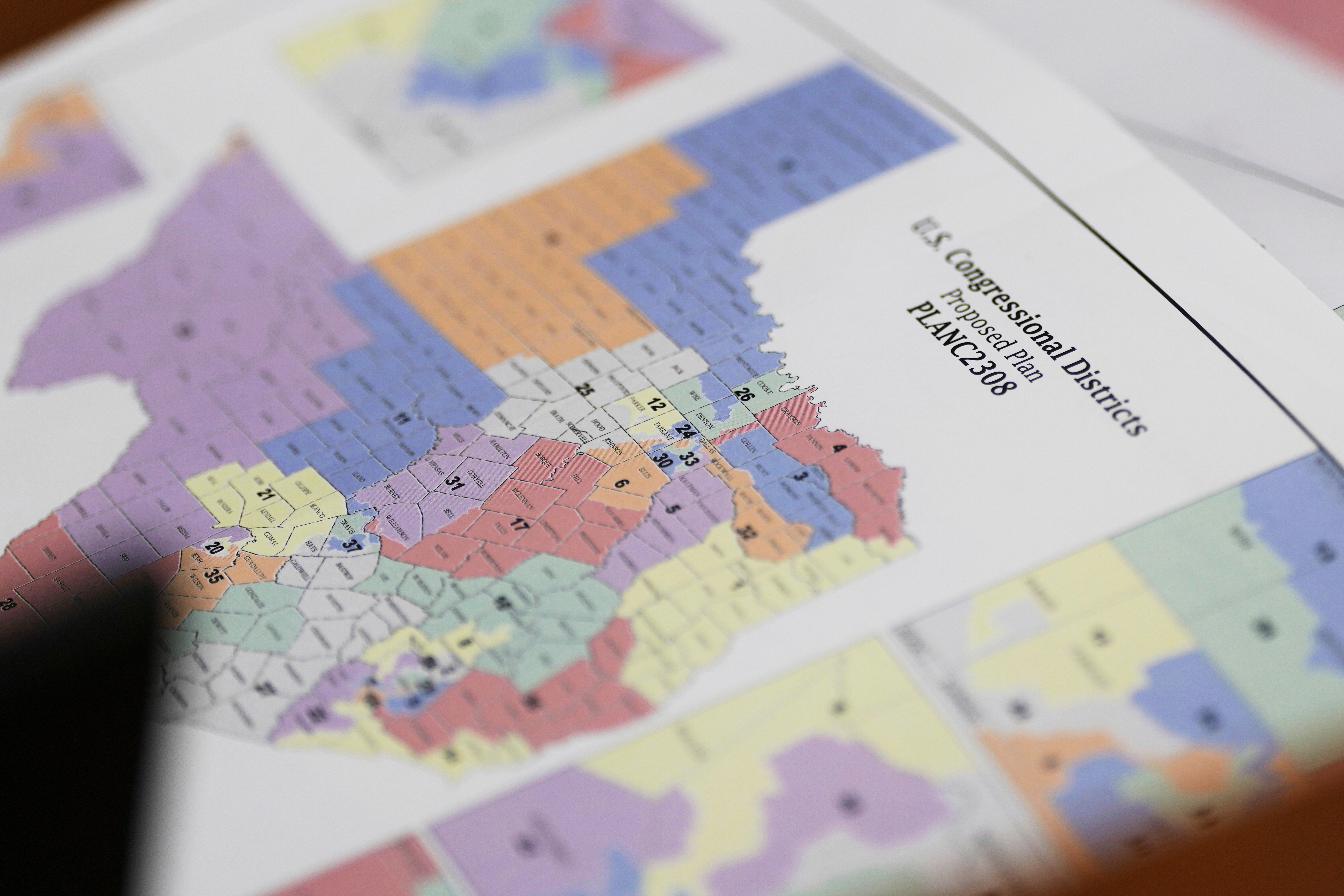 A map of U.S Congressional Districts proposed plan is seen at a Texas legislators' public hearing on congressional redistricting in Austin, Texas, Friday, Aug. 1, 2025. 