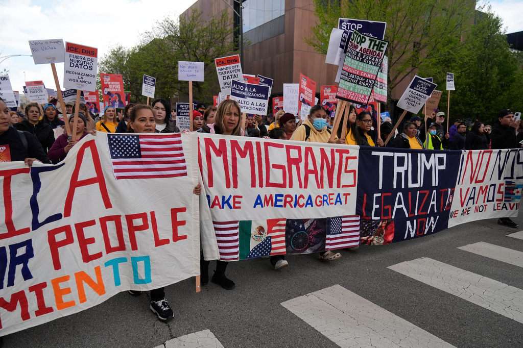 FILE - Thousands of people march in a May Day rally and protest May 1, 2025, in Chicago. 