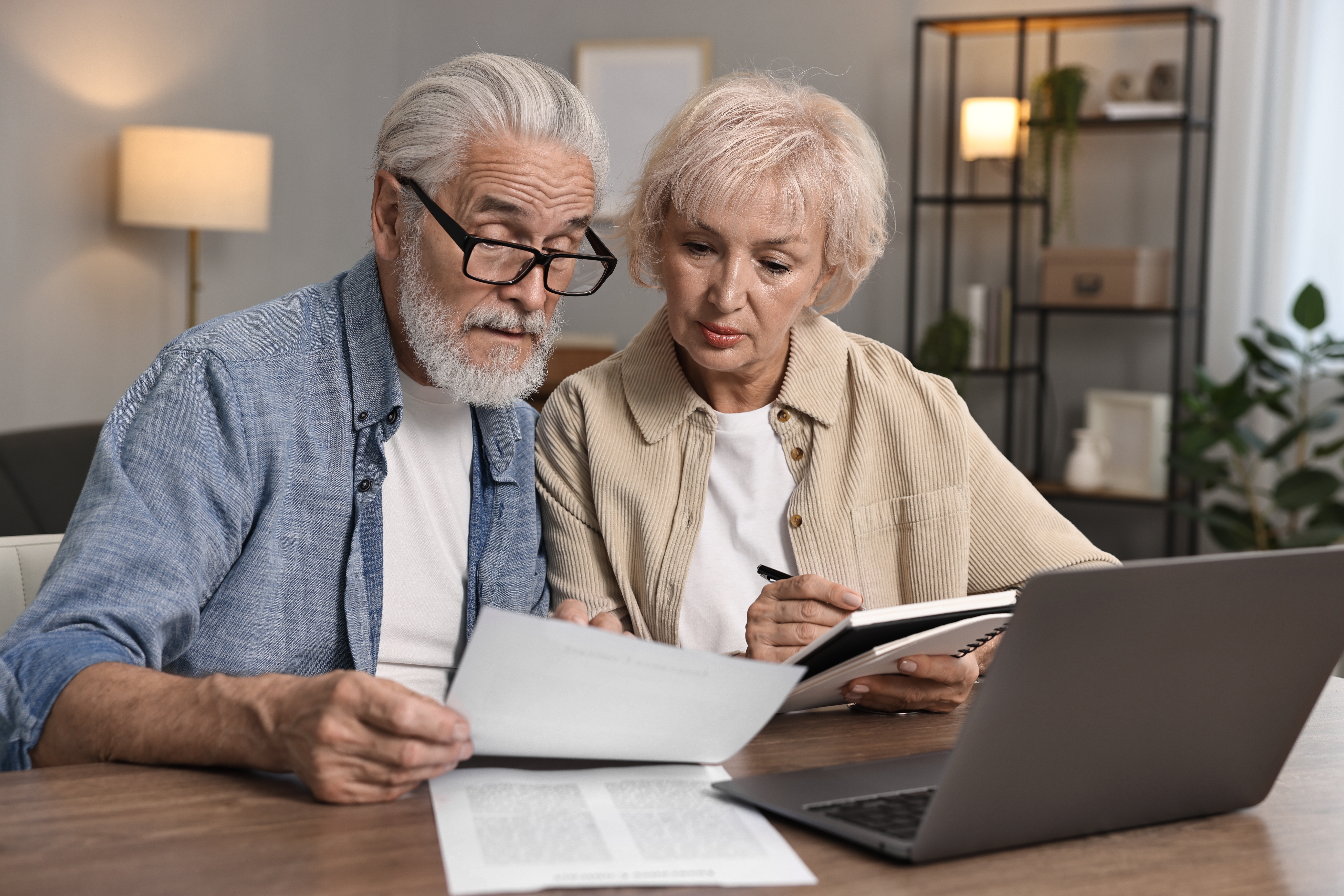 A couple looking at their bills. 