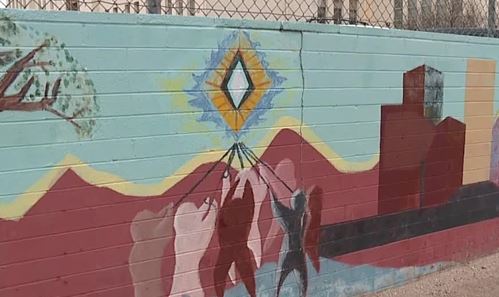 A muralist is leading fundraising efforts to restore a classic school mural.