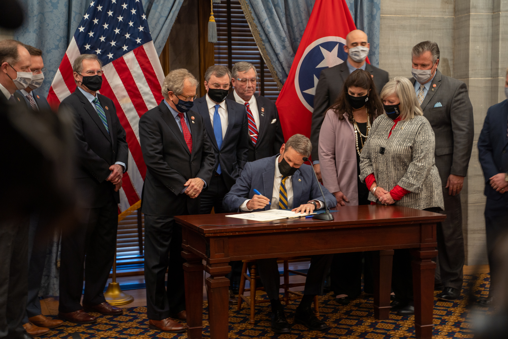 lee signs ed bills.jpeg