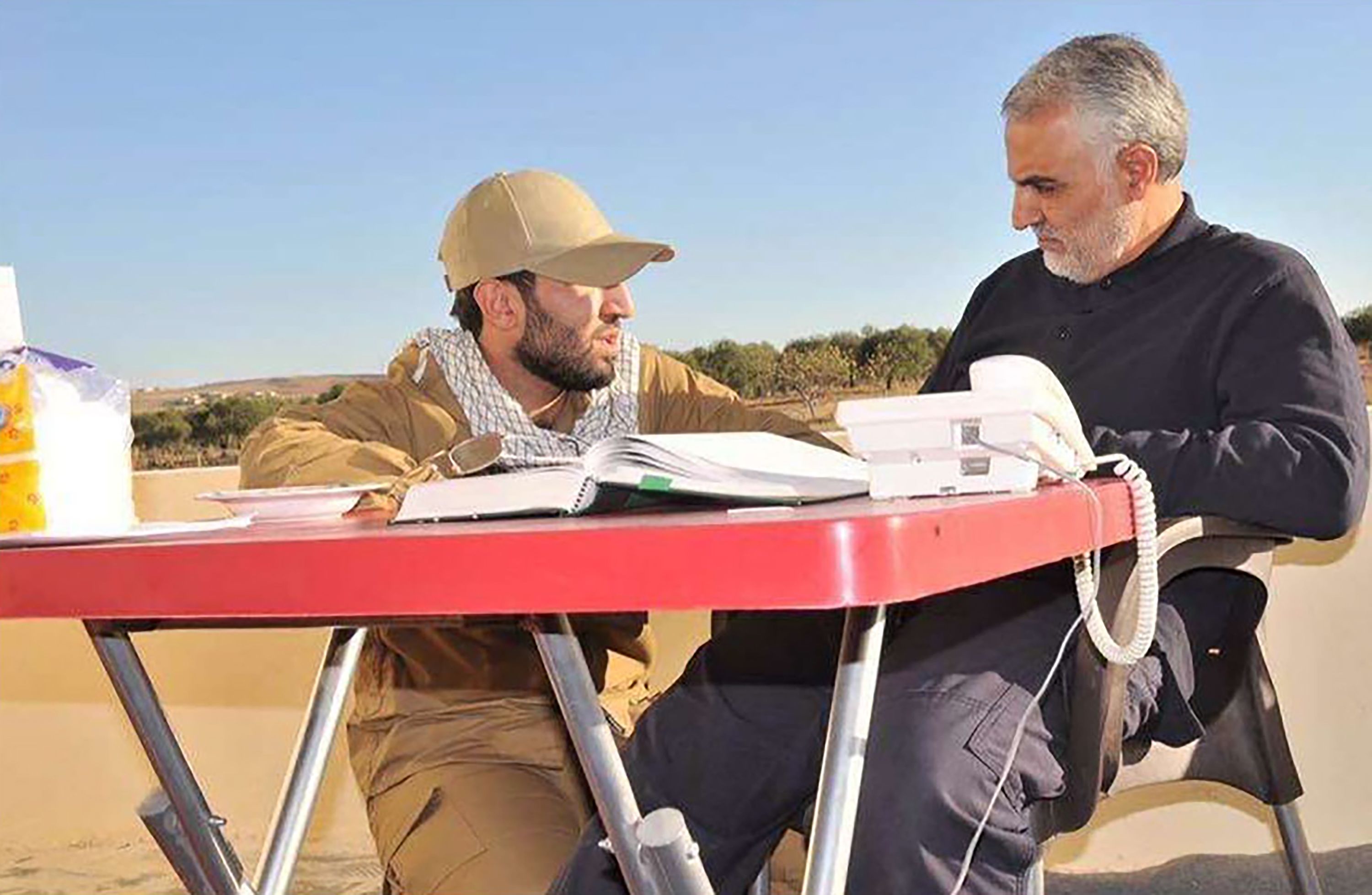 This photograph of Mohammad Baqer Saad Dawood al-Saadi, left, with Qasem Soleimani, was featured on al-Saadi's Snapchat account, according to a federal criminal complaint. Soleimani is the Iranian commander who was killed in January 2020 by a US airstrike ordered by President Donald Trump at Baghdad International Airport.