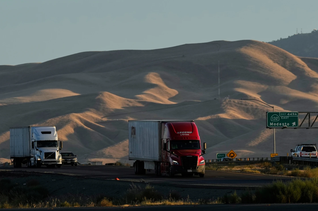 Freight trucks travel northbound on Interstate 5 Highway, Wednesday, Sept. 3, 2025, in Tracy, Calif.