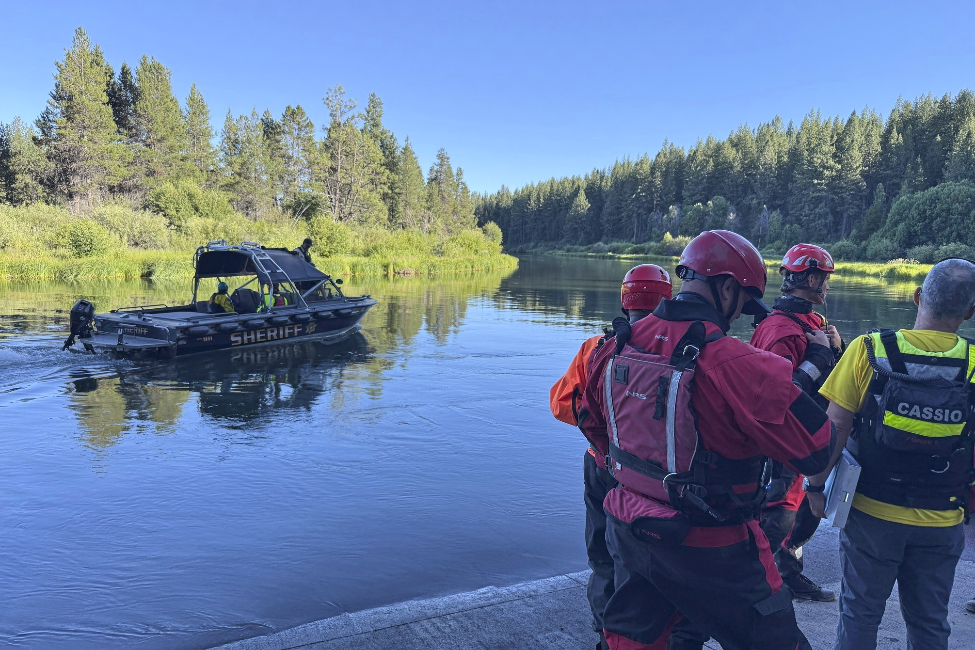 This photo provided by the Deschutes County Sheriff's Office shows search and rescue teams on the Deschutes River about 10 miles from Bend, Ore., after a fatal waterfall accident Saturday, July 19, 2025. 