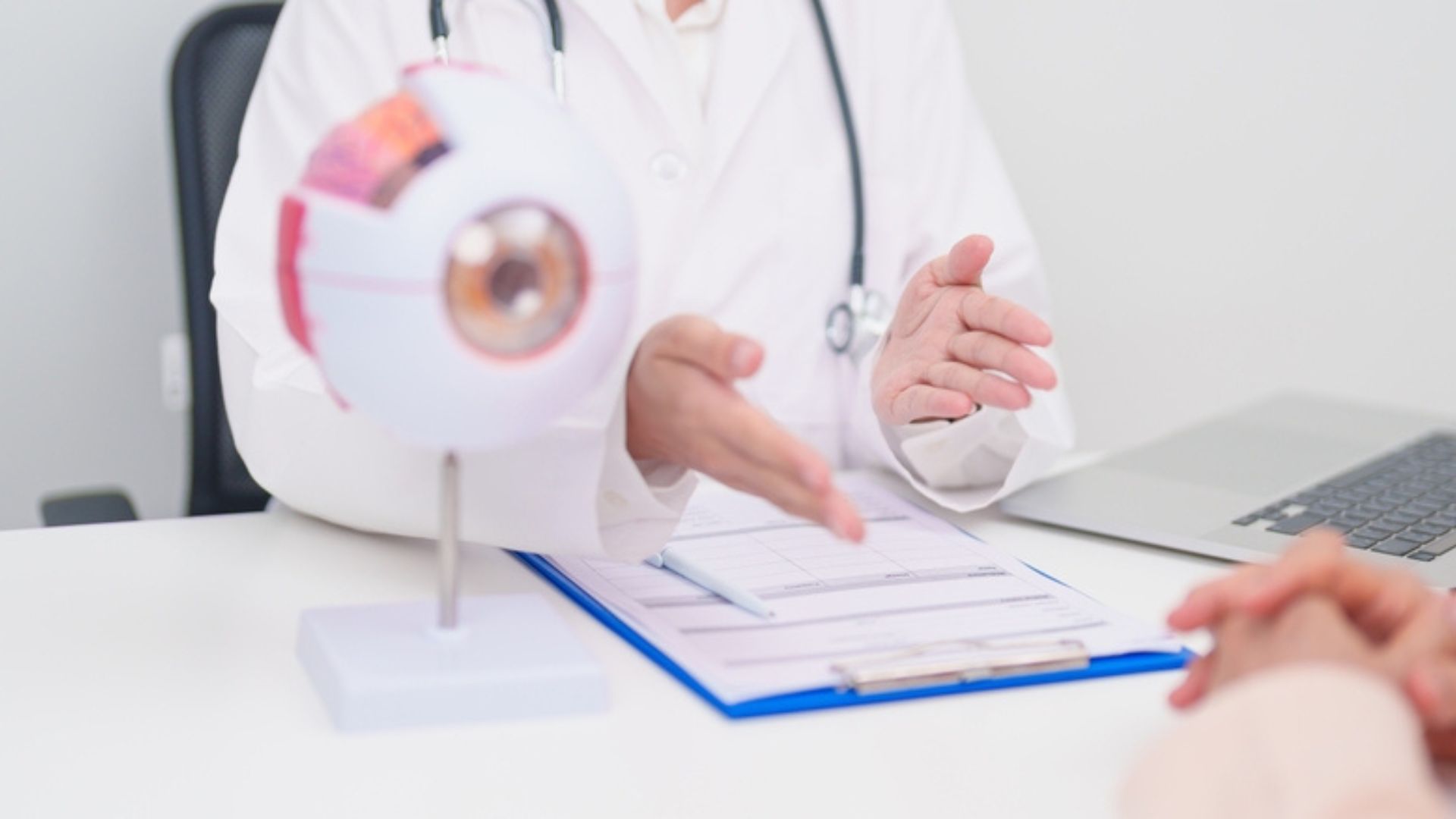 Stock image of a doctor talking with a patient.