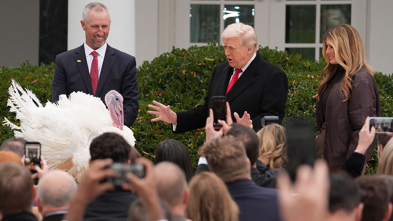 President Donald Trump and first lady Melania Trump, stand next to national Thanksgiving turkey Gobble during a pardoning ceremony in the Rose Garden of the White House, Tuesday, Nov. 25, 2025, in Washington.