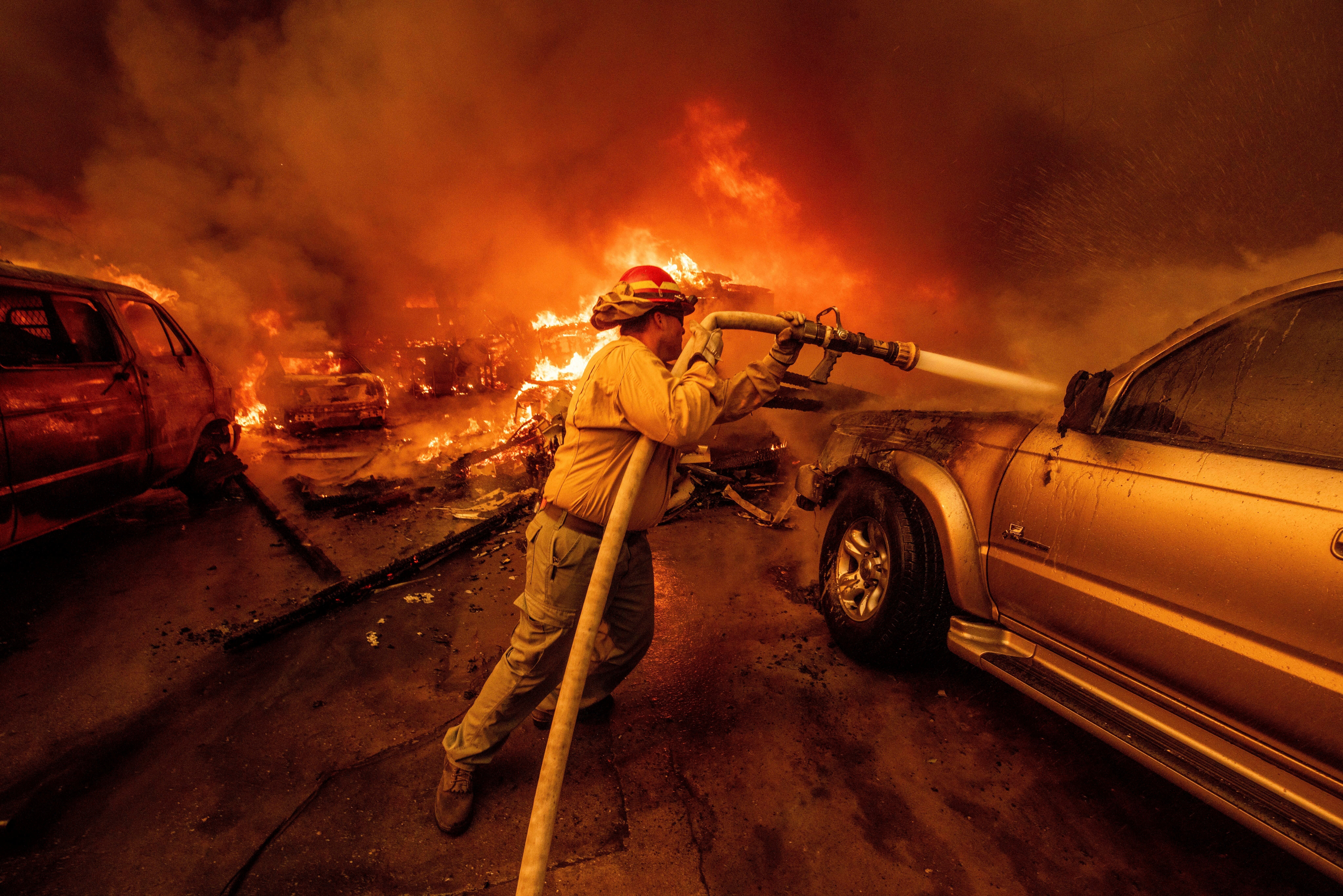 FILE - A firefighter battles the Eaton Fire, Jan. 8, 2025, in Altadena, Calif.