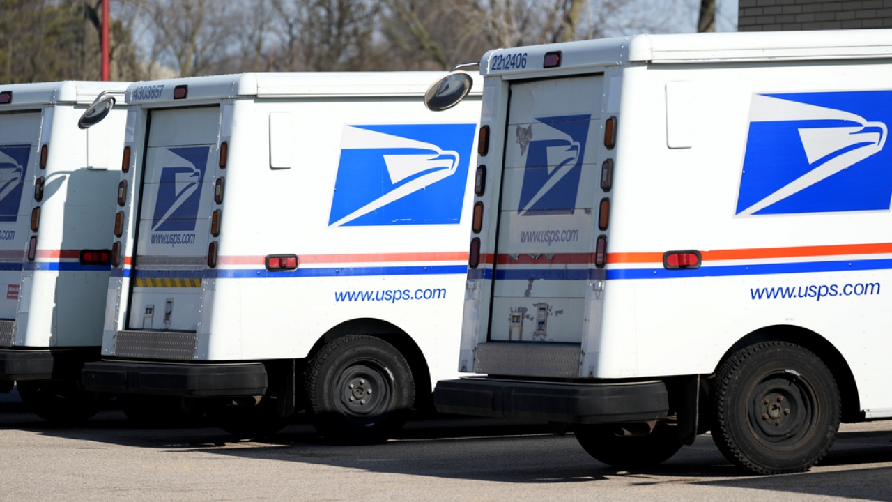 USPS trucks are shown.