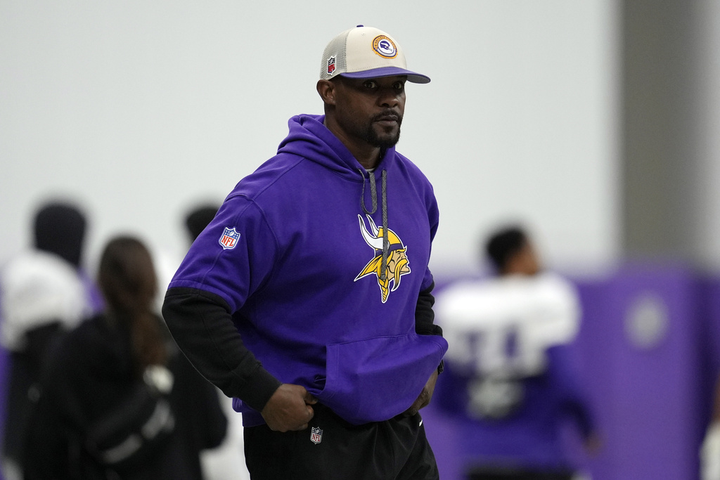 File photo of Minnesota Vikings defensive coordinator Brian Flores standing on the field during an NFL football workout in Eagan, Minn., Oct. 30, 2024.