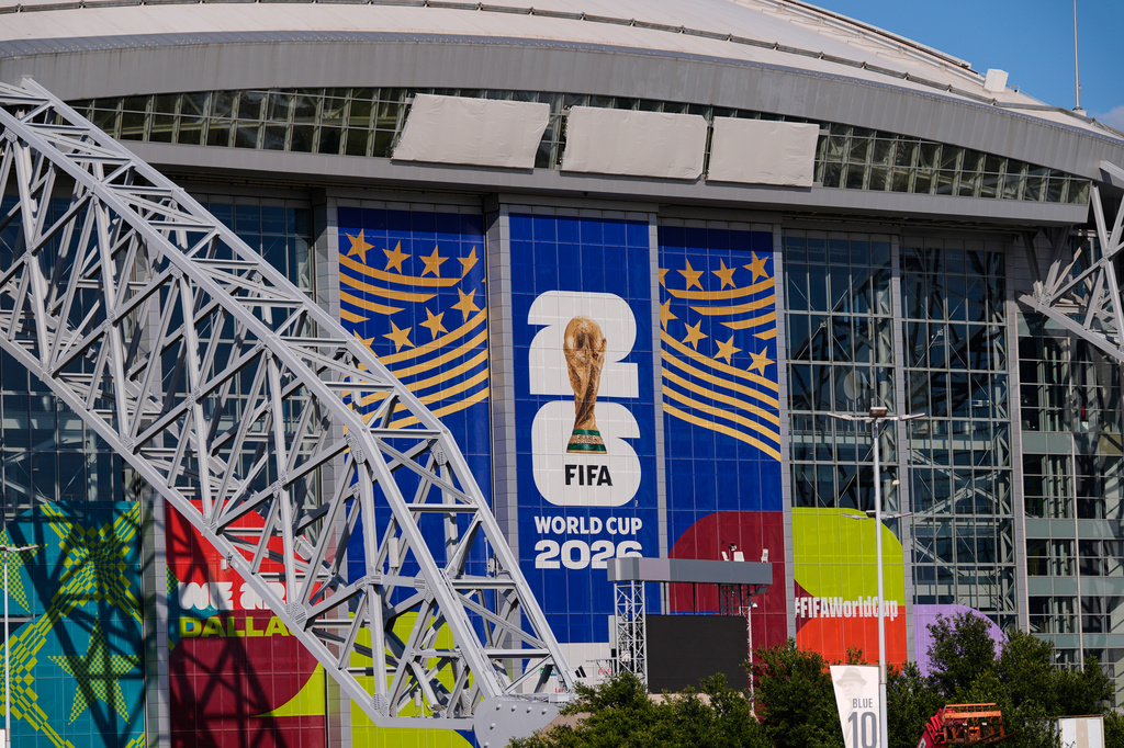 AT&T Stadium, where upcoming World Cup soccer matches are scheduled to be played, has its name covered by three gray tarps Monday, June 1, 2026, in Arlington, Texas. 