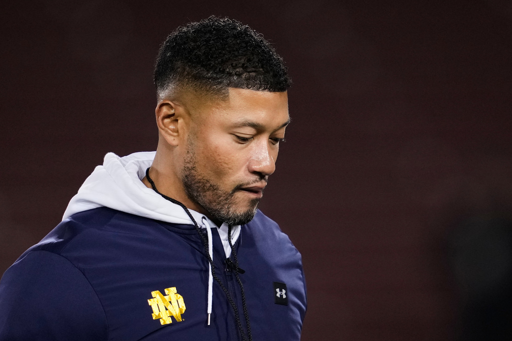 Notre Dame head coach Marcus Freeman walks on the field before an NCAA college football game against Stanford, Saturday, Nov. 29, 2025, in Stanford, Calif. 