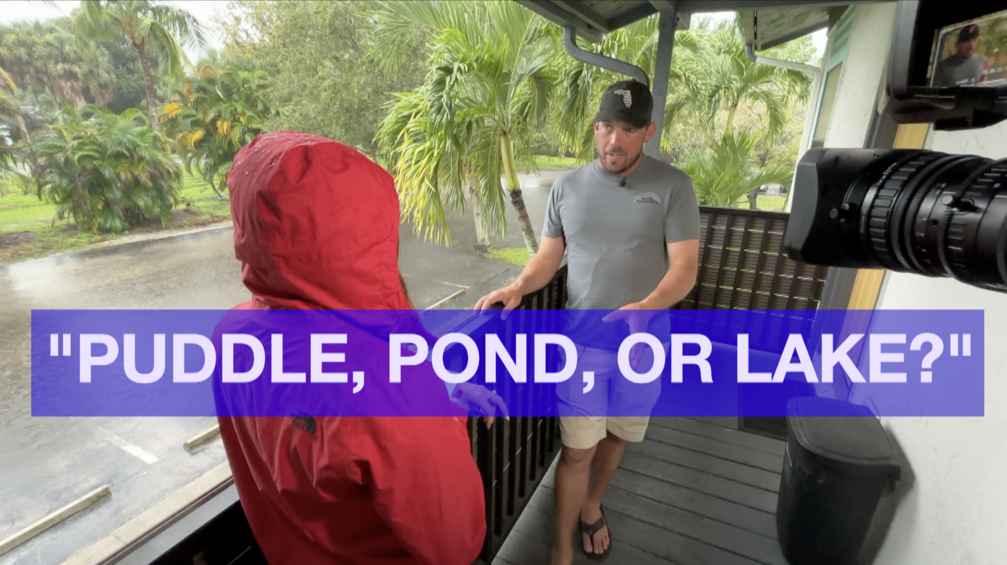 WPTV's Samantha Gutierrez listening to residents concerned over parking lot flooding.