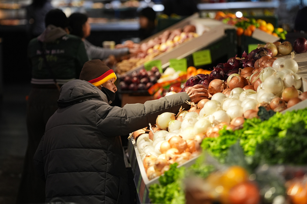 Customers shop at the Reading Terminal Market in Philadelphia.