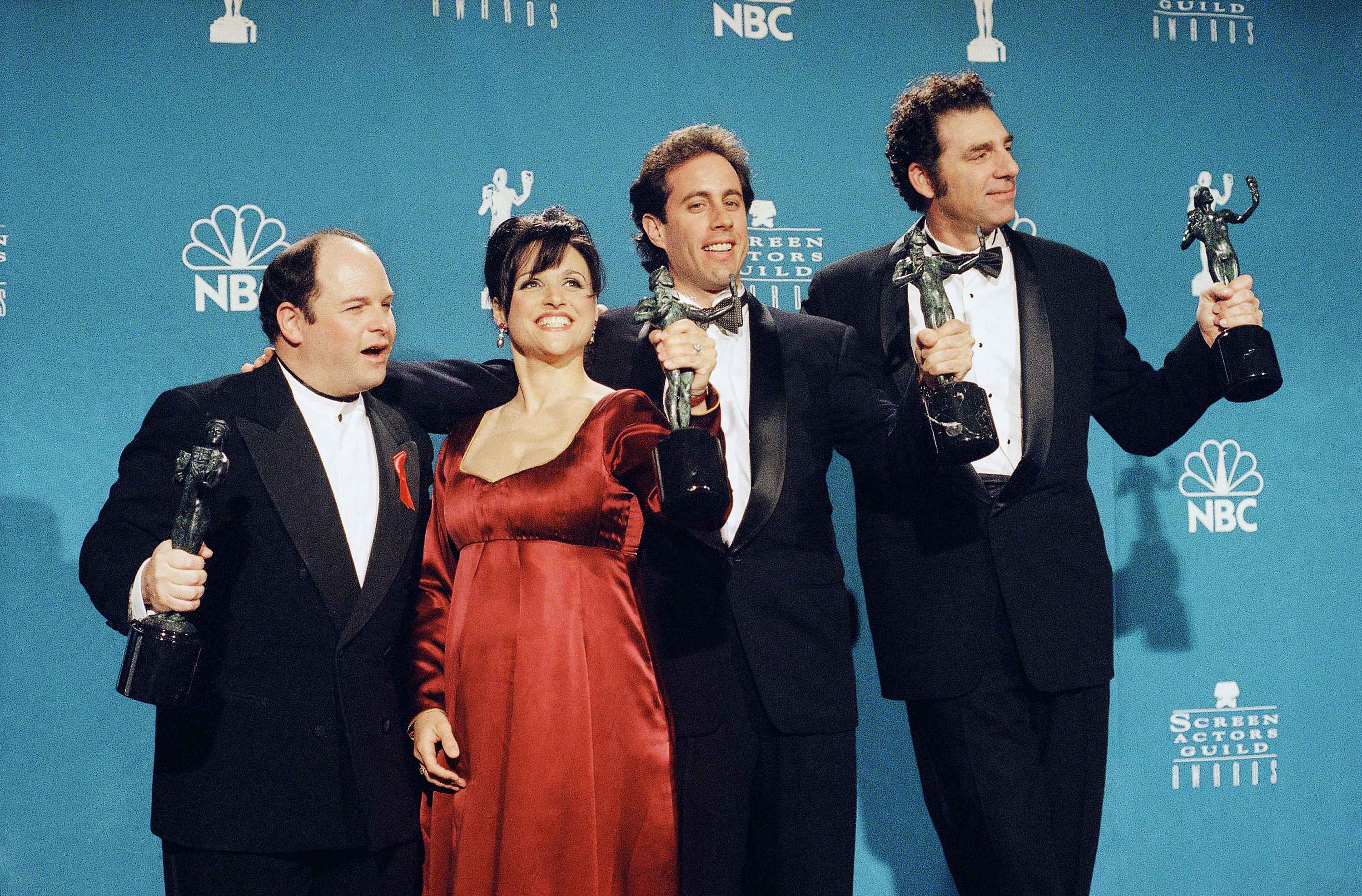 'Seinfeld' cast members Jason Alexander, Julia Louis-Dreyfus, Jerry Seinfeld and Michael Richards pose with trophies at Screen Actors Guild Awards in 1997