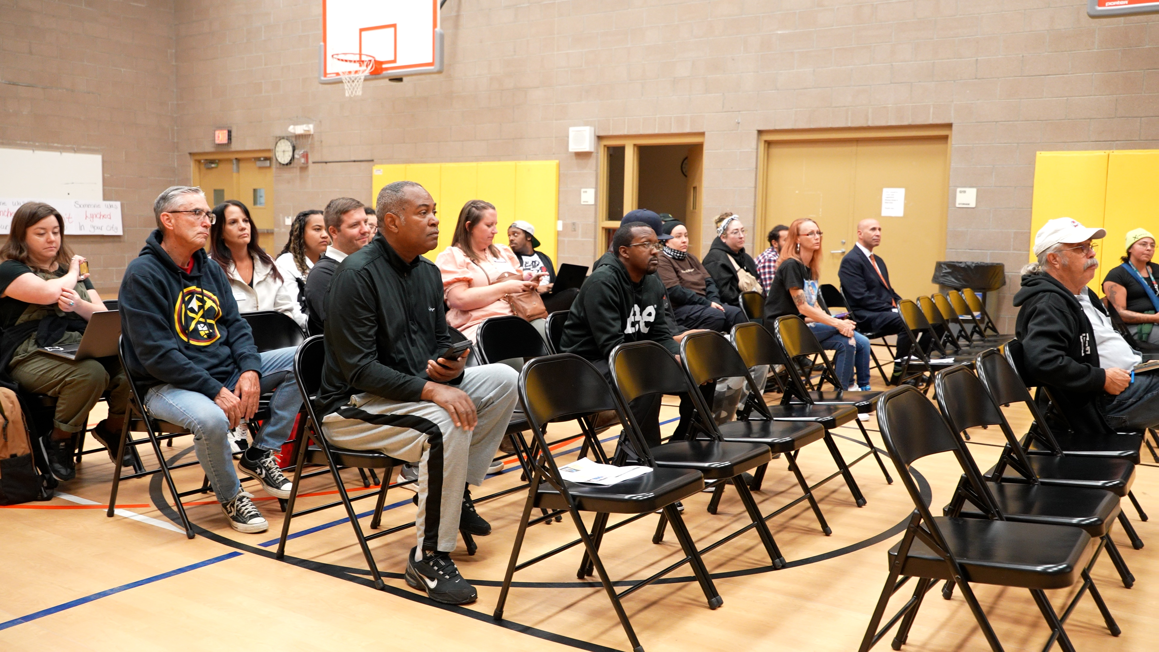 Community members sit at Monday night's gathering with Aurora City Council members.