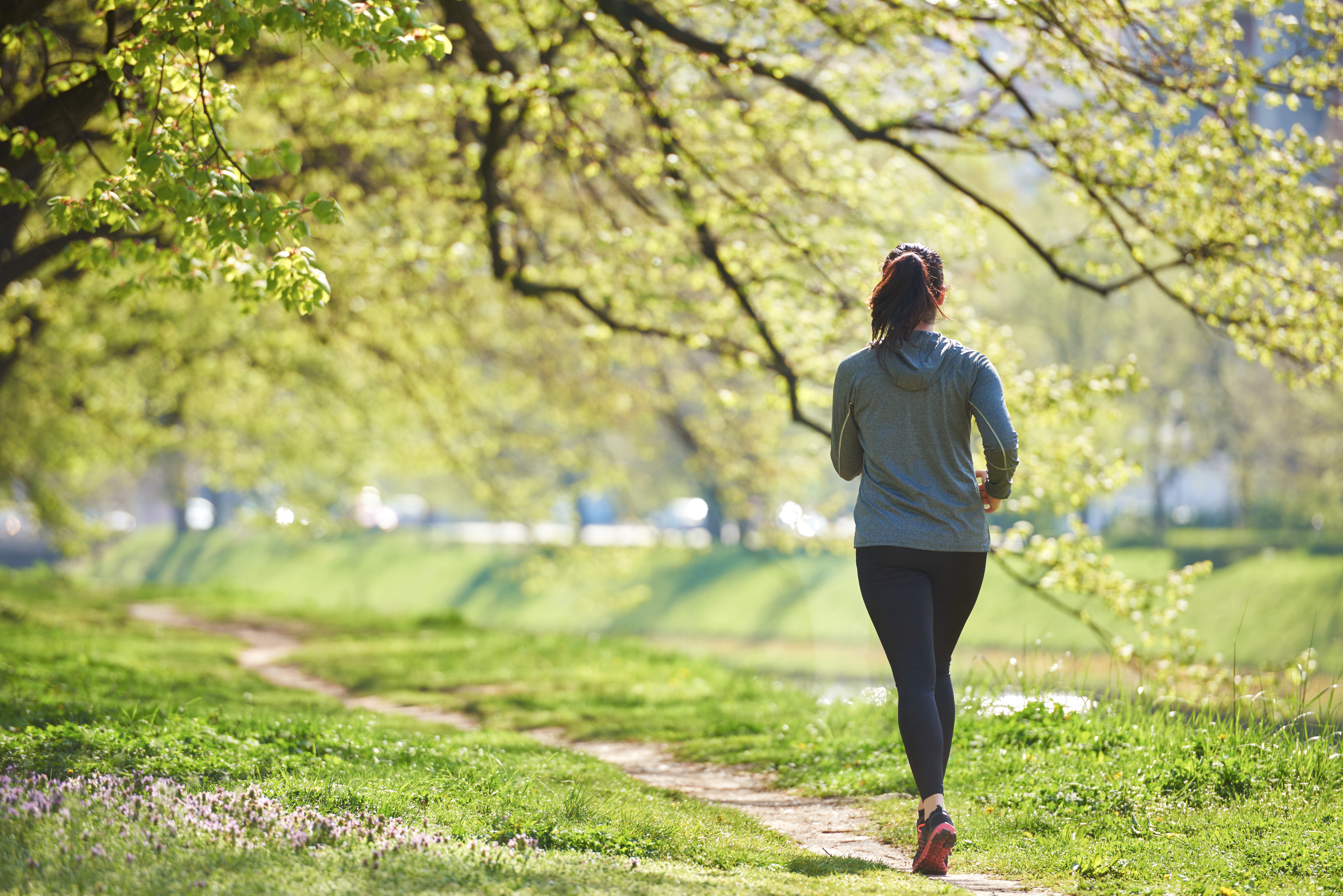 woman jogging in park at morning