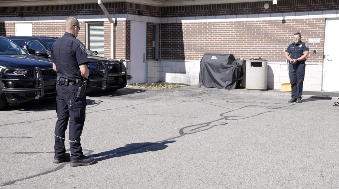 Officer Ethan Rennaker deploying BolaWrap for demonstration