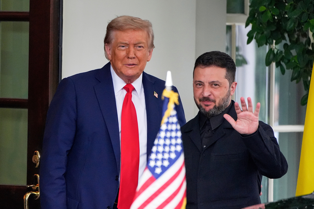 President Donald Trump, left, greets Ukraine's President Volodymyr Zelenskyy as he arrives at the White House, Aug. 18, 2025, in Washington. 