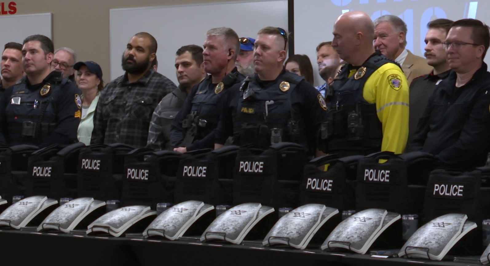 Officers lined up in front of their new rifle protection vests
