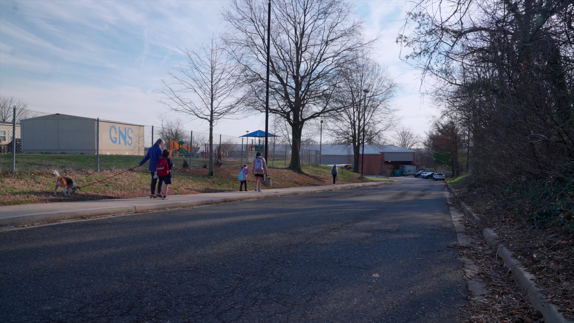 Jennifer Stapleton walks her daughter to school